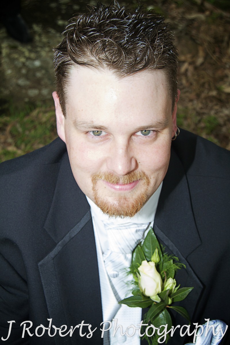 Groom smiling up at the camera - wedding photography sydney